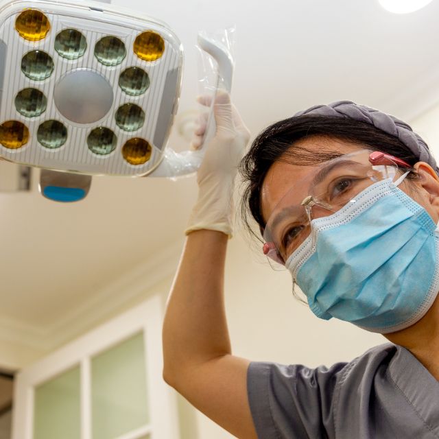 Patient view of doctor, looking up to doctor from a bed