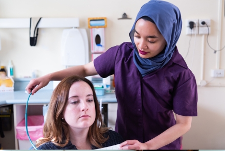 Dental assistant and patient